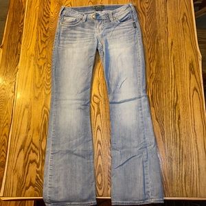 Silver boot cut washed out blue jeans. Never worn.